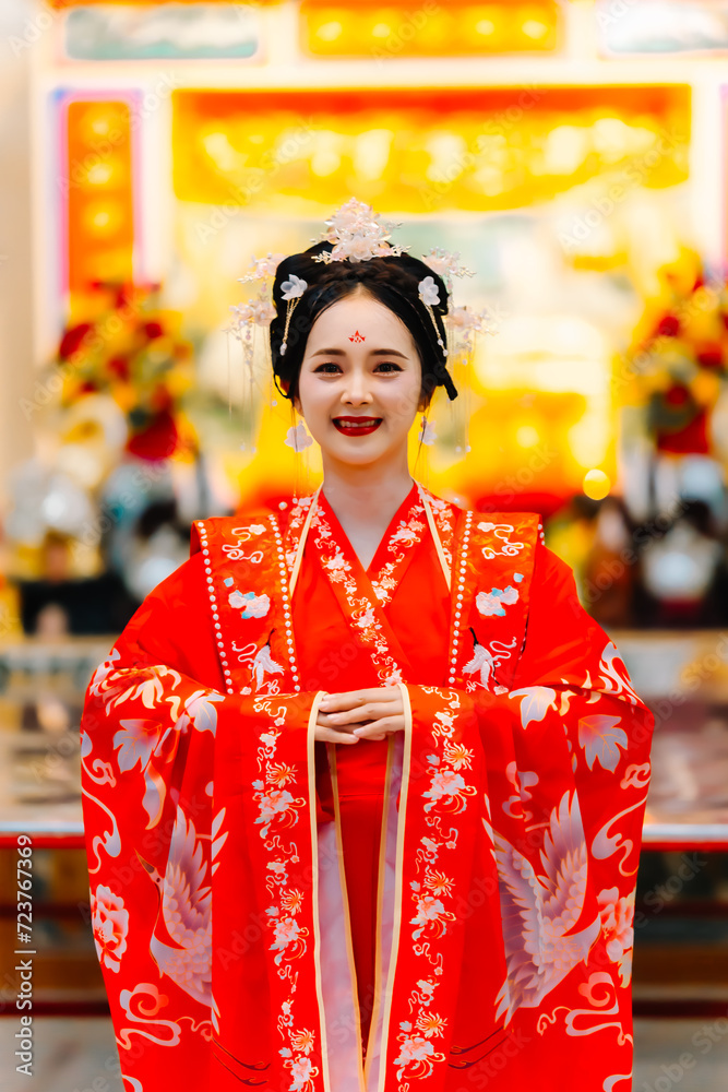 Woman dress China New year. portrait of a woman. person in traditional costume. woman in traditional costume. Beautiful young woman in a bright red dress and a crown of Chinese Queen posing.