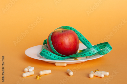 Weight Loss Pills and Measuring Tape, Diet Supplements Capsules, Obesity Lose Tablets, Color Drugs Pile