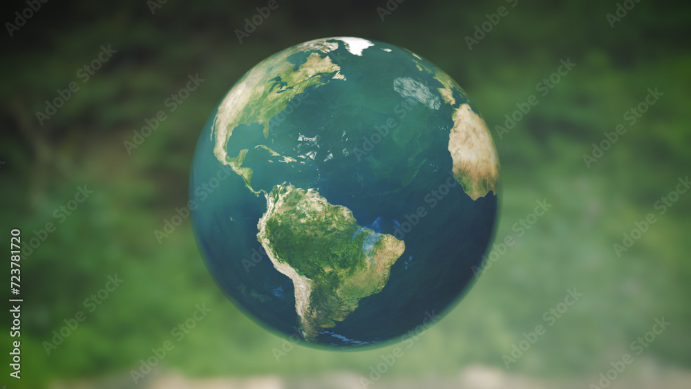 Green globe made of glass in front of reflecting forest background, concept sustainability, climate change, protection of nature Green globe made of glass in front of reflecting forest background, concept sustainability, climate change, protection of nature