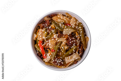 Delicious Asian dish udon with hot peppers, green beans, spices and herbs