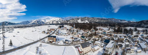 Hakuba, Japan in Winter with. mountains in the background - aerial drone panorama photo