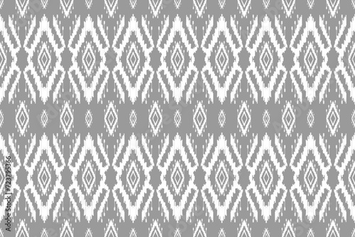 Fabric ethnic ikat art. Seamless pattern in tribal. Aztec geometric ornament print. Design for background, wallpaper, illustration, fabric, clothing, carpet, textile, batik, embroidery.