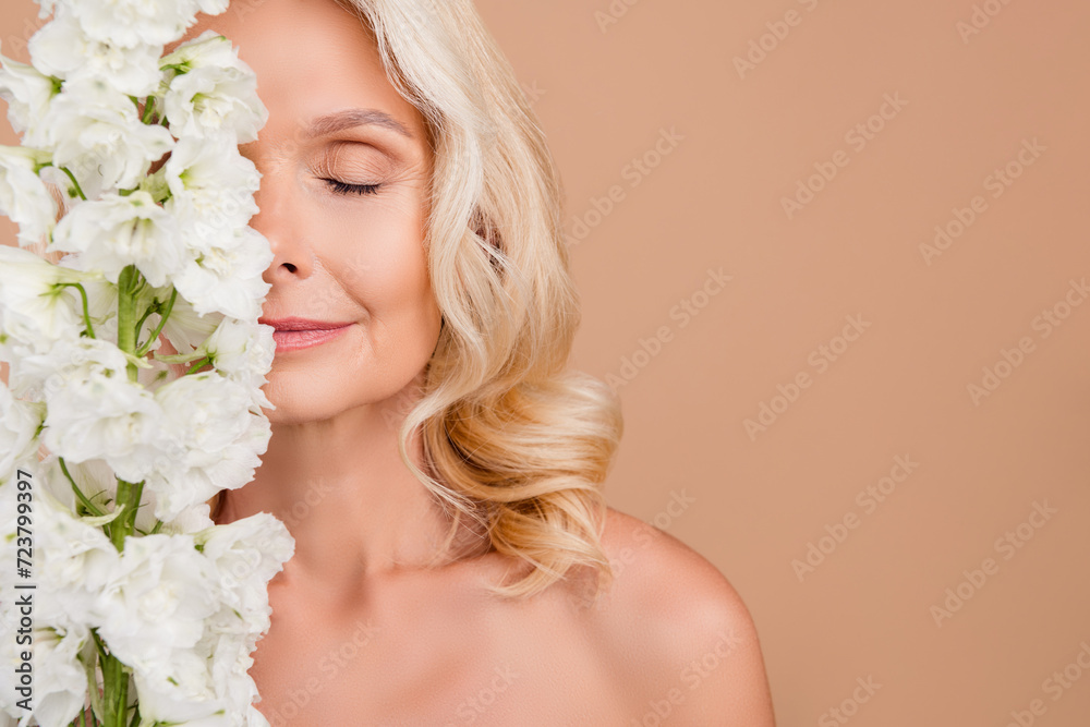 Photo of pretty cute lovely elderly lady hiding face clean clear perfect ideal skin empty space isolated on beige color background Photo of pretty cute lovely elderly lady hiding face clean clear perfect ideal skin empty space isolated on beige color background