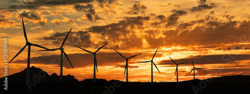 Silhouette of wind turbines. Sky with clouds during sunset. Renewable and sustainable energy, climate change, technology. 3D illustration