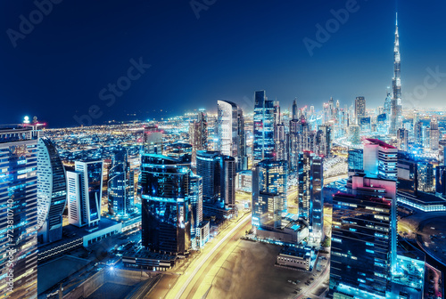 Nighttime skyline of Dubai, United Arab Emirates. Rooftop view.