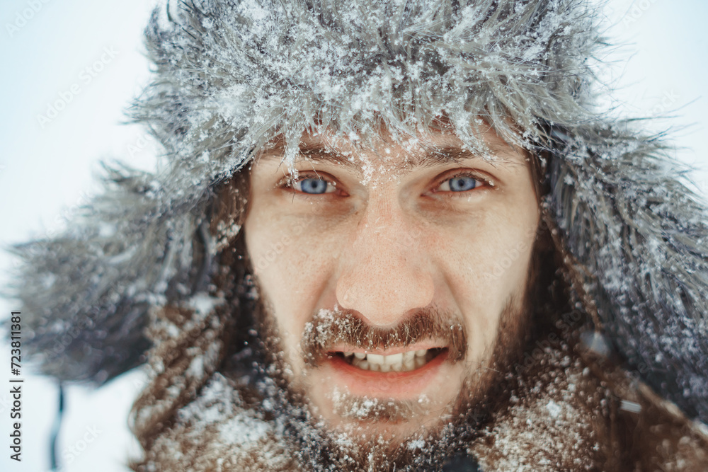 a bearded man in an earflap in winter a bearded man in an earflap in winter