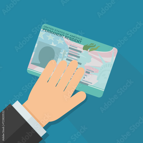 A hand presents a green card, permanent resident card of USA on a blue background in flat design style with a long shadow	