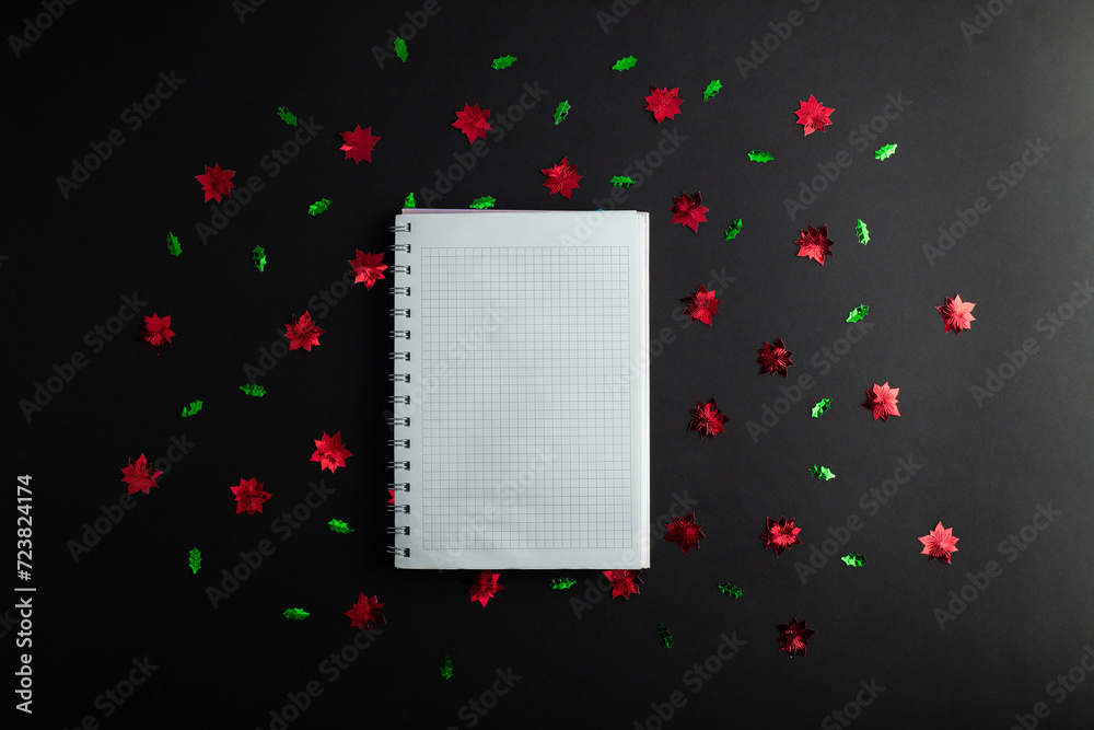 top view photo of notebook, writing in spiral notepad letter to santa on isolated black background with copyspace. Concept happy new year, merry Christmas, valentines day. top view photo of notebook, writing in spiral notepad letter to santa on isolated black background with copyspace. Concept happy new year, merry Christmas, valentines day.