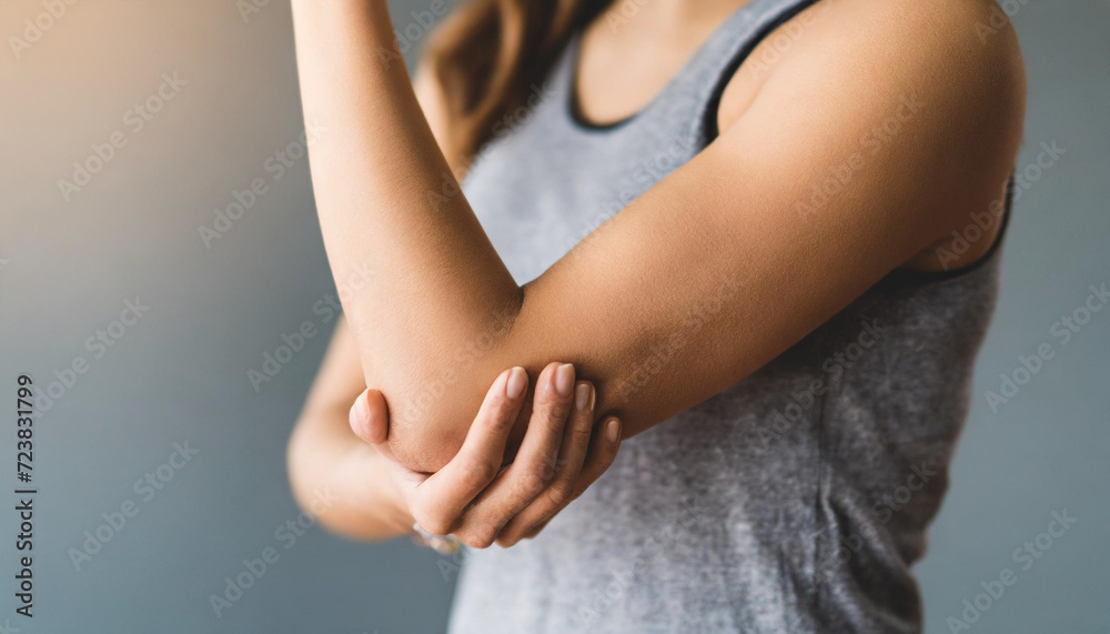 woman's elegant elbow, gracefully holding open skin in a pristine studio background in pain, emphasizing beauty and vulnerability woman's elegant elbow, gracefully holding open skin in a pristine studio background in pain, emphasizing beauty and vulnerability