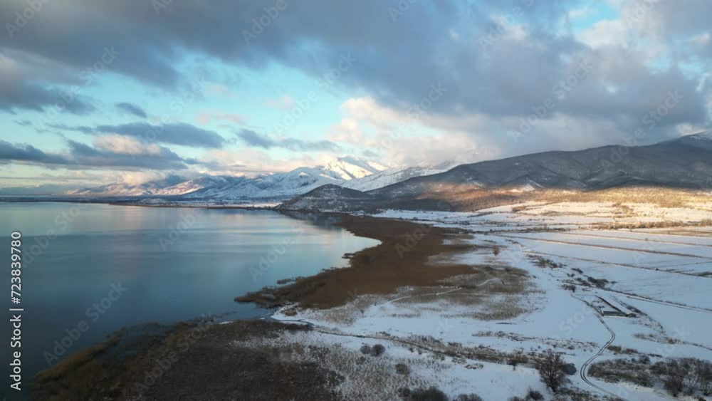 Aerial view of lake prespes with snowy mountains in the back Aerial view of lake prespes with snowy mountains in the back