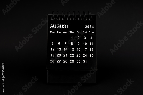 Black Calendar for August 2024. Desktop calendar on a black background.