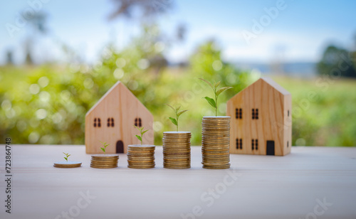 Business Finance and Money concept, Save money for prepare in the future. Trees growing on coin.Close up stacking coins with green bokeh background.