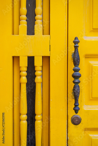 Vintage metal knocker on a wooden door