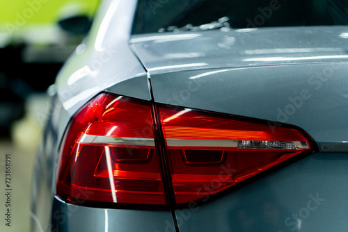 Εκτύπωση καμβά close-up of the rear red light of a beautiful expensive gray car at a detailing