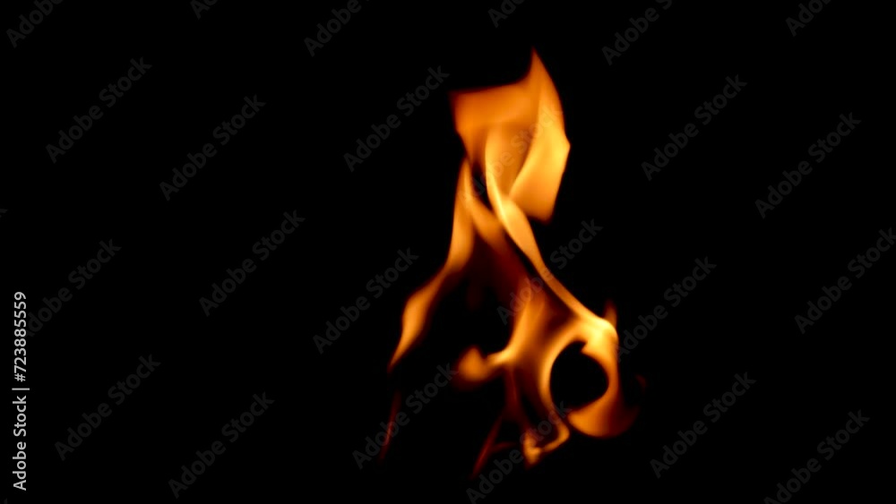 Small flames move quickly against a dark background. Small flames move quickly against a dark background.