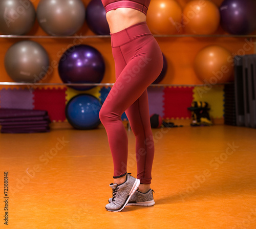 Female sportswear clothes on perfect body, Sneakers and leggings pants.