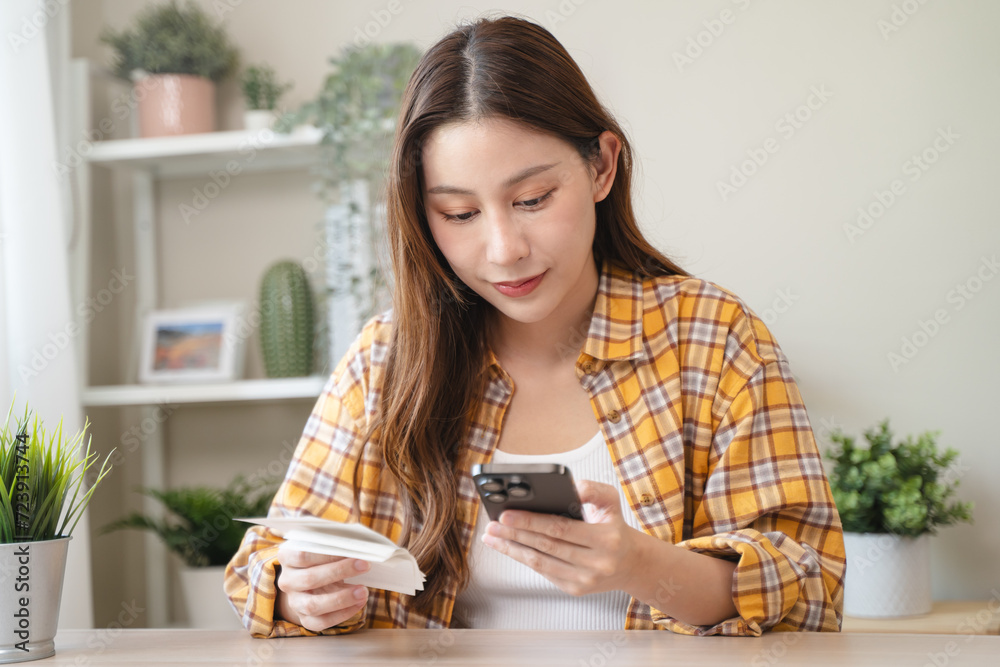 Digital Finance at Fingertips: Close-Up Hands Seamlessly Handling Bills and Smartphone for Efficient Online Payment and Financial Management Digital Finance at Fingertips: Close-Up Hands Seamlessly Handling Bills and Smartphone for Efficient Online Payment and Financial Management