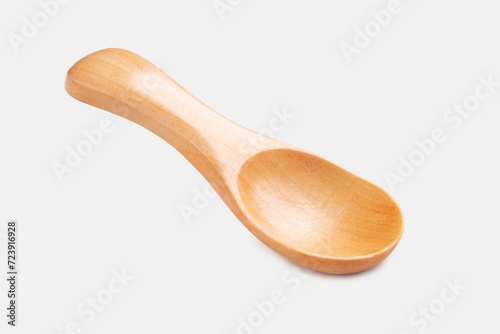 A clean and empty wooden spice spoon isolated on a white background