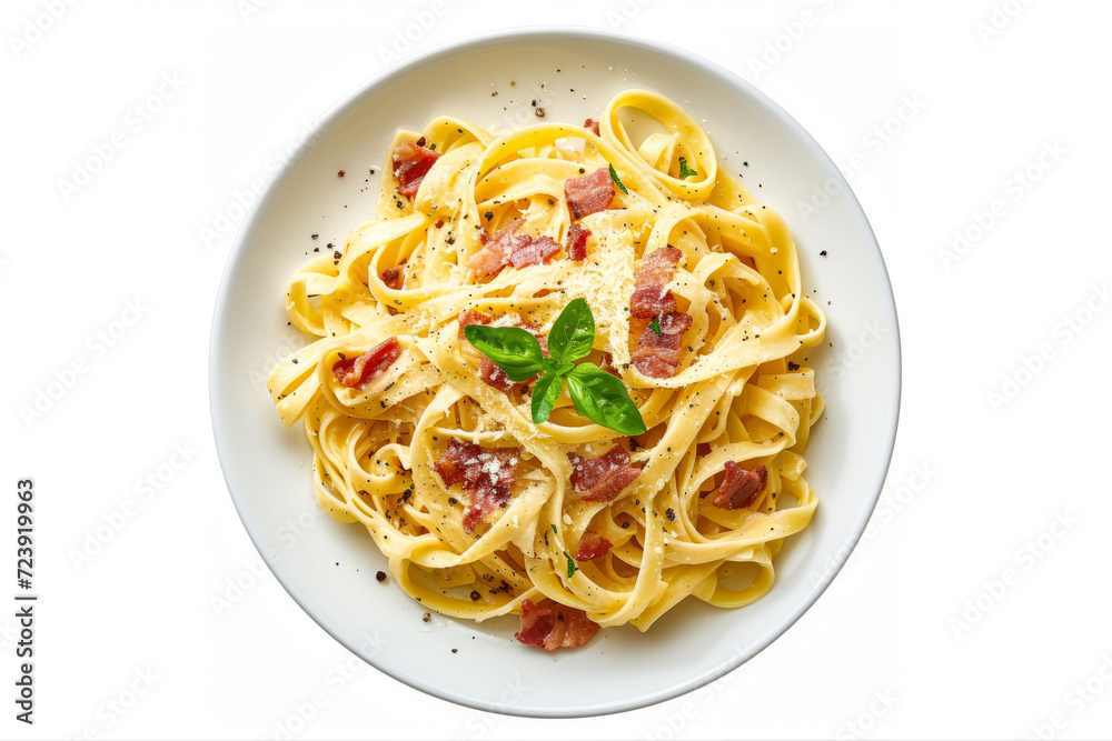 Fettuccine Carbonara in a plate. Pasta with carbonara sauce and bacon. White background, top view. Fettuccine Carbonara in a plate. Pasta with carbonara sauce and bacon. White background, top view.