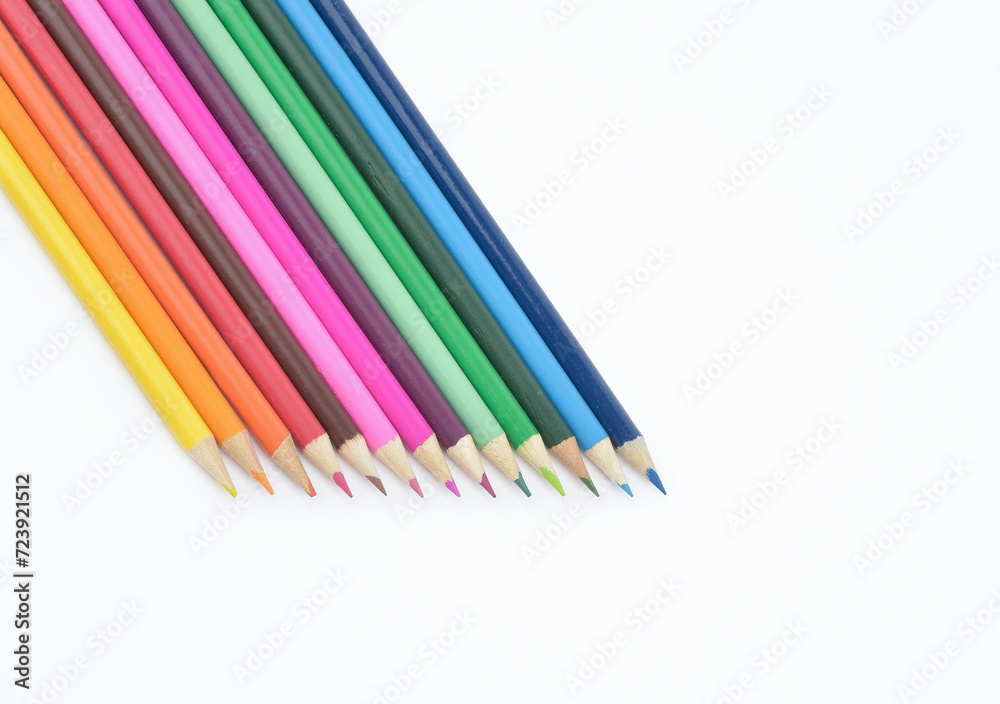 Obraz premium Seamless wooden coloured pencils placed in a row facing down isolated on light background