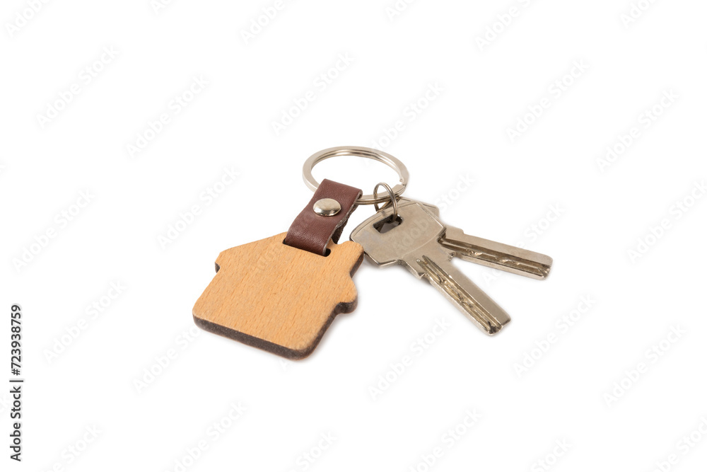 House keys with a keychain in the shape of a house isolated on white background.Design element.Real estate and insurance concept.Copy space. Rent, sale or purchase of real estate. House keys with a keychain in the shape of a house isolated on white background.Design element.Real estate and insurance concept.Copy space. Rent, sale or purchase of real estate.