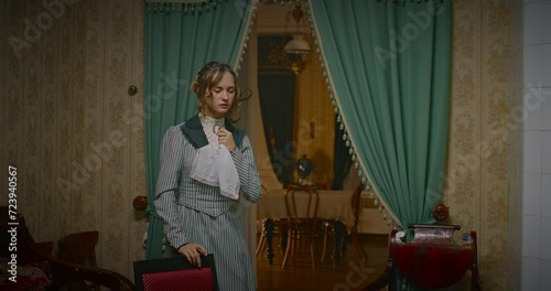 history of 19th century, crying young woman sitting down on chair in retro room, 4K, Prores