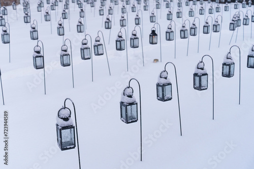 Group of empty lanterns in a cemetery photo