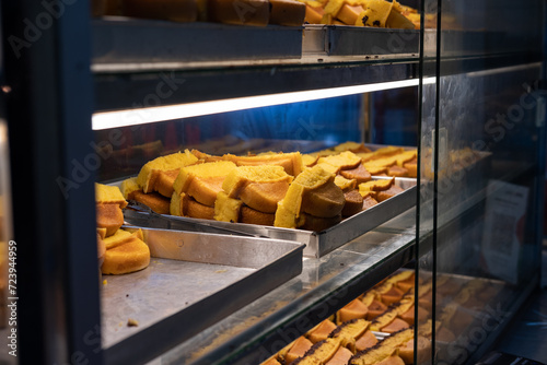 Display of Kue Pukis, Indonesia traditional pancake-like cake, on a street market vendor. photo