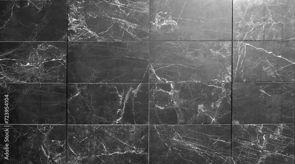 Marble tiles with black and gray colors  with white streaks. Background and texture.