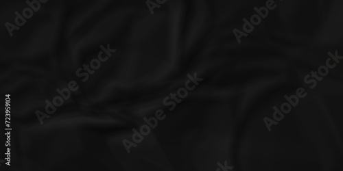 Dark crumple black fabric paper wrinkled poster template ,blank glued creased paper texture background. black paper crumpled backdrop background. used for cardboard and clarkboard.