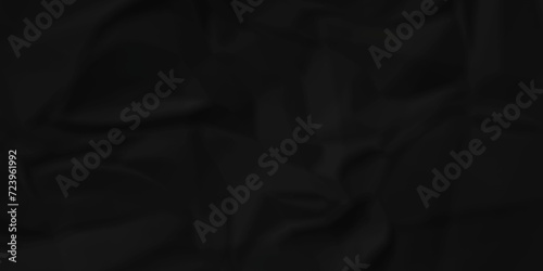Dark crumple black fabric paper wrinkled poster template ,blank glued creased paper texture background. black paper crumpled backdrop background. used for cardboard and clarkboard.
