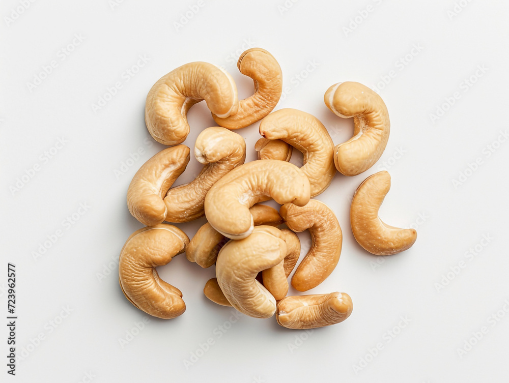 Cashews isolated on white background in minimalist style. Studio photography. Cashews isolated on white background in minimalist style. Studio photography.