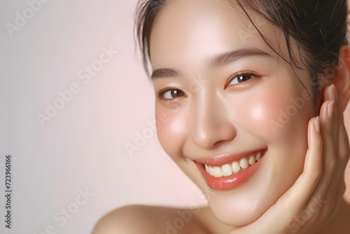 Closeup Beautiful smiling asian korean woman touch face with smooth healthy skin