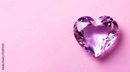 Crystal heart on a purple pink background with copy space 