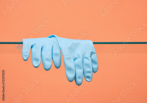 Two rubber blue gloves to protect hands when cleaning. Copy space for text.