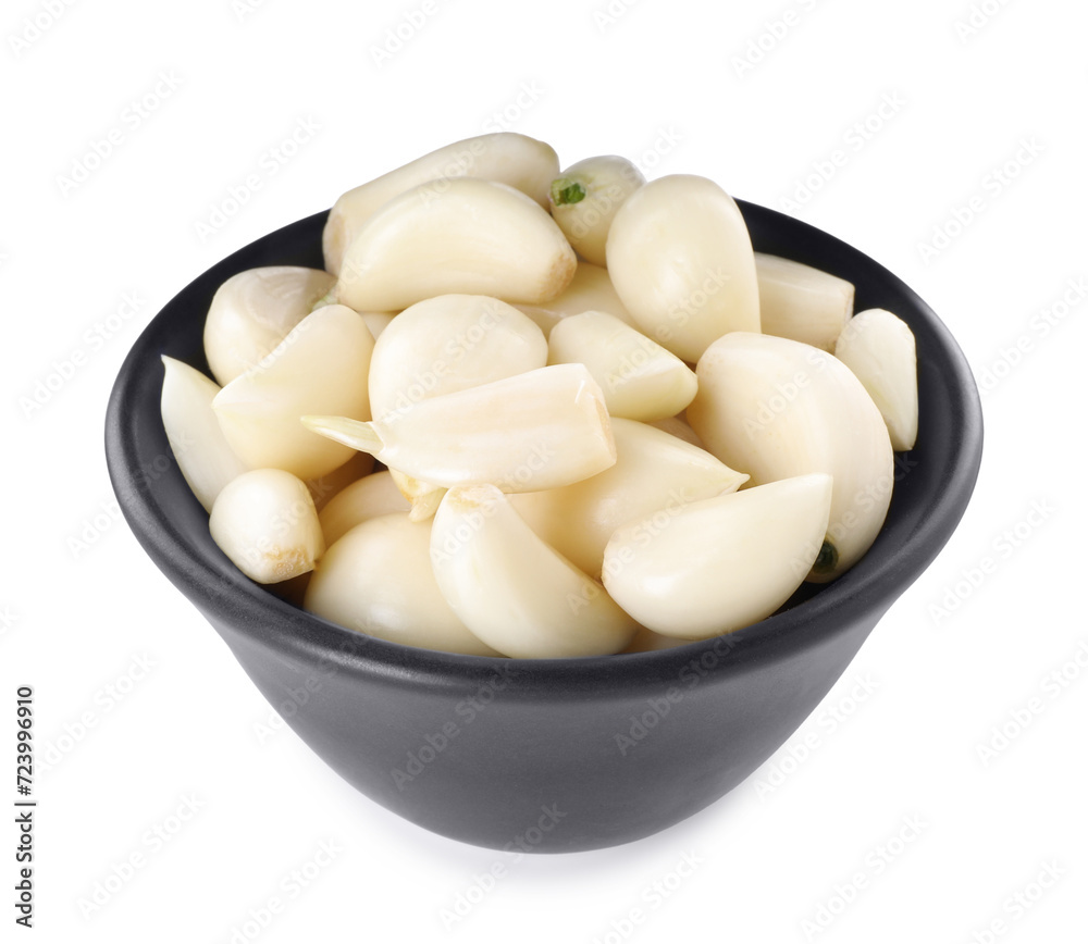 Peeled cloves of fresh garlic in bowl isolated on white Peeled cloves of fresh garlic in bowl isolated on white