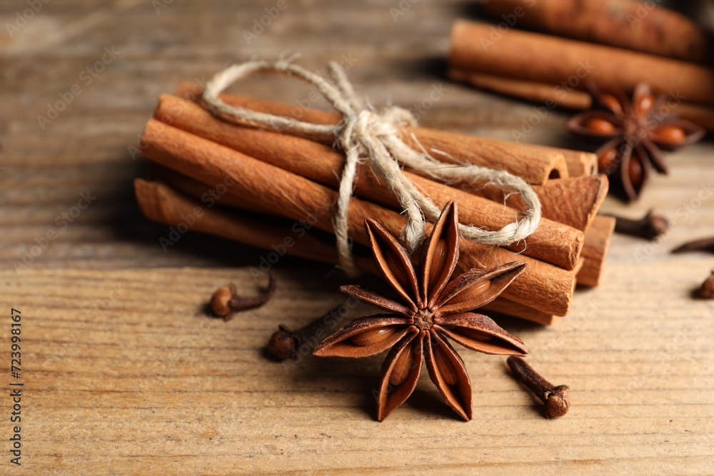 Different aromatic spices on wooden table, closeup Different aromatic spices on wooden table, closeup