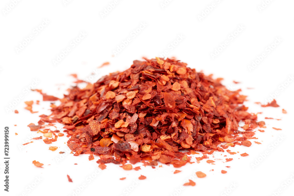 Pile of red chili pepper flakes isolated on white background Pile of red chili pepper flakes isolated on white background