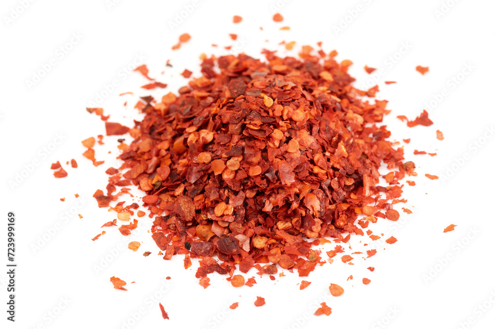 Pile of red chili pepper flakes isolated on white background Pile of red chili pepper flakes isolated on white background