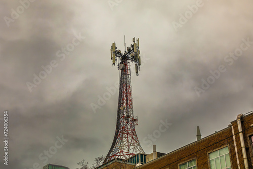 A microwave and cellphone communications tower atop an apartment building _ in downtown Toronto.