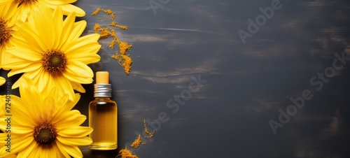 Arnica oil. Cosmetic lotion oil with natural fresh Arnica Extract. Copy space. Photo texture. Horizontal banner. Minimalism. photo
