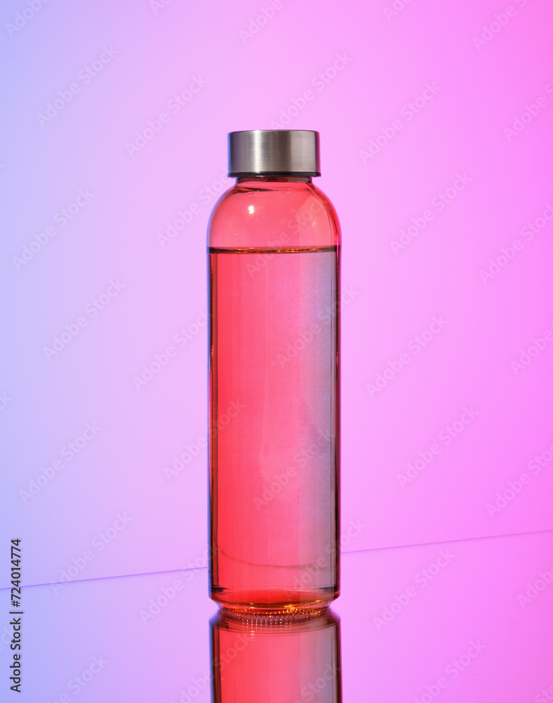 A bottle with a drink in it. Juice or mineral water.