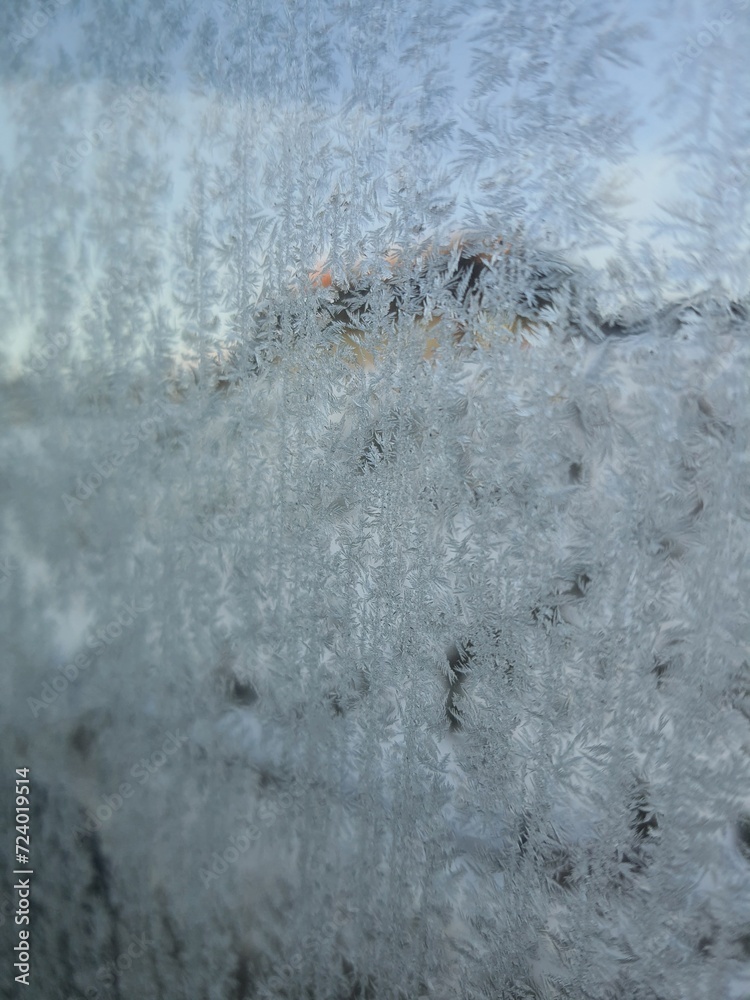 Ice crystals formations on glass car window. Ice crystals formations on glass car window.