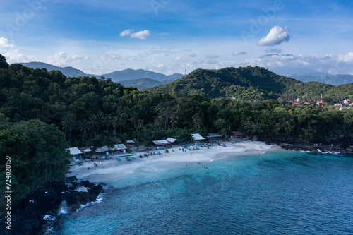 Landscape of the white sand beach of Bias Tugel situated near Padangbai harbour in Bali Indonesia with the volcano Agung nearby.
