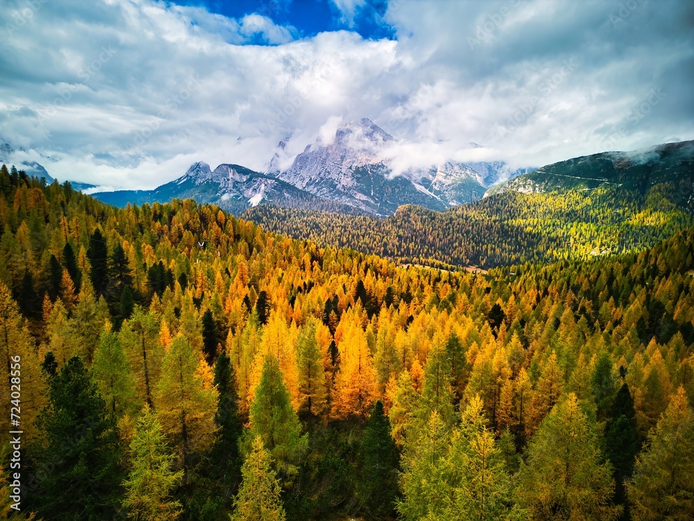 Aerial drone view of Dolomites Mountains in autumn season with forest. Italy Aerial drone view of Dolomites Mountains in autumn season with forest. Italy