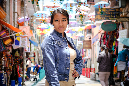 Bilde på lerret beautiful young latin woman strolling through the colorful and touristic streets