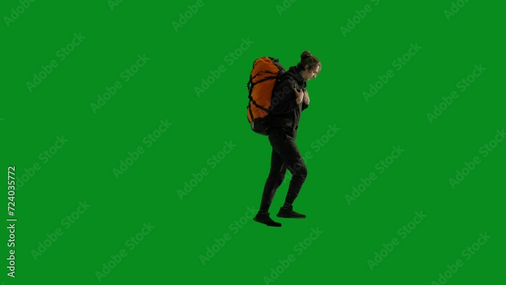 A male traveler with a backpack on his back climbing upwards on green screen. After reaching the top the man takes a smartphone out of his pocket and speaks on video call, shows the area, says goodbye A male traveler with a backpack on his back climbing upwards on green screen. After reaching the top the man takes a smartphone out of his pocket and speaks on video call, shows the area, says goodbye