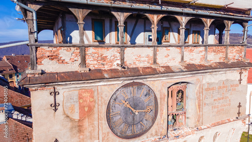 Birds eye view over Sighisoara city. Aerial photography of medieval city of Sighisoara from Romania, taken from a drone with the Clock Tower in the front. 