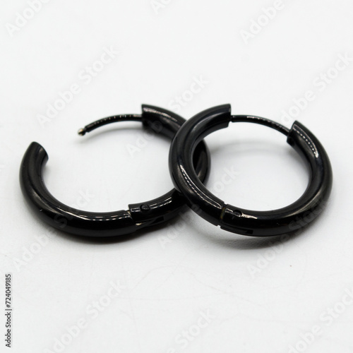 Fake hard earring. Black ear ring. Imitation jewelry. Accessory for rockers, rap, hip-hop, bikers, emo. Creation of a scenic view. Pirate style.