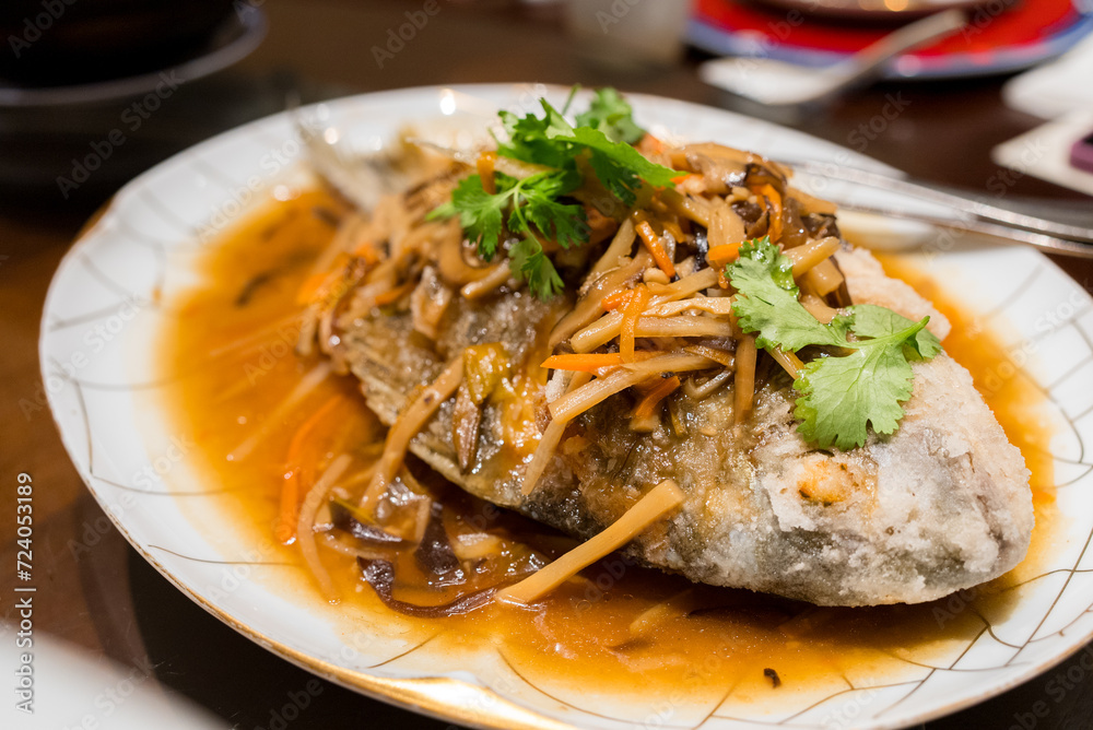Pan fried fish with sauce in Taiwanese restaurant Pan fried fish with sauce in Taiwanese restaurant